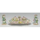 A Coalbrookdale-type porcelain inkstand, centred by a taperstick and flanked by a pair of wells,