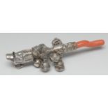 An 18th century silver baby's rattle, chased with flowers, scrolls and architectural arches,