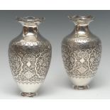 A pair of Persian Islamic silver ovoid vases,