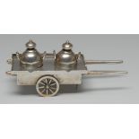 A Chinese silver novelty cruet, as a pair of churns on a handcart, 11.