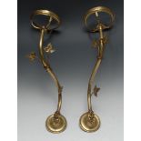 A pair of Victorian brass adjustable wall lamp brackets, with provision for oil lamp reservoirs,