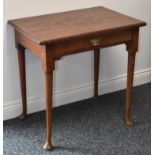 A George II walnut lowboy, rounded rectangular top, above a frieze drawer,