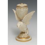 A Graingers Worcester model of a bird, holding a reticulated pot pourri between it's wings,