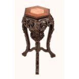 A Chinese hardwood hexagonal jardiniere stand, beaded top with inset soapstone panel,