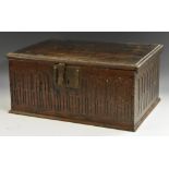 A 17th century oak boarded table-box, hinged cover enclosing a till,
