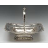 A George IV silver shaped rectangular swing-handled half-fluted pedestal cake basket,