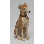 An Austrian cold-painted bronze, of a recumbent whippet, wearing a dog collar, 6cm high,