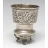 A 19th century Russian silver and niello cup, decorated with a broad band of scrolling leaves,