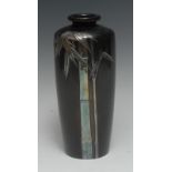 A Japanese silver overlaid dark patinated bronze vase, sparsely applied with bamboo, 25cm high,