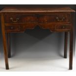 A George III mahogany lowboy, rounded rectangular top above a long cockbeaded drawer, shaped apron,