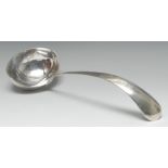 A 19th century Dutch silver soup ladle, 32cm long,