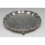 A William IV silver shaped circular salver, fluted leafy scroll border,