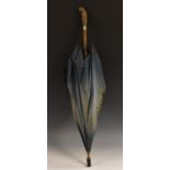 An early 20th century novelty umbrella, the handle carved as a parakeet, 81cm long, c.