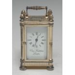 A Charles Frodsham silver cased carriage clock, the white signed dial with Roman numerals,