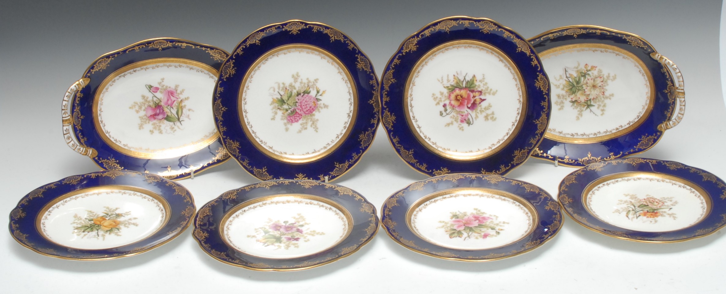 A Coalport eight piece dessert service, comprising two oval serving dishes and six plates,