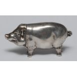 A 20th century silver novelty vesta, in the form of a pig, 7cm long,