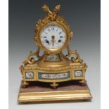 A French gilt metal mantel clock, inscribed Hatton, drum case with Arabic numerals,
