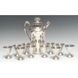 A South American silver cocktail set, comprising a shaker and ten conical goblets,