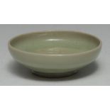 A Chinese celadon circular bowl, 12cm diam,