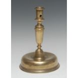 A late 17th century brass candlestick, cylindrical sconce, substantial domed base, 23cm high, c.