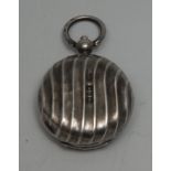 A Victorian silver wrythen-fluted circular sovereign case, loop suspension, 3cm diam,