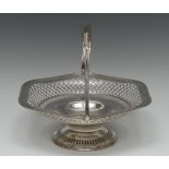 An Edwardian silver shaped circular swing handled cake basket, pierced trellis border,
