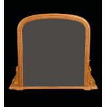 A 19th century giltwood and gesso arched rectangular chimney glass,