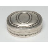 A Continental silver oval snuff box, push-fitting cover embossed with oval reserves, 5cm wide,