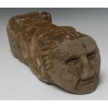 A Medieval sandstone corbel, carved with the head of a man, 43cm long,