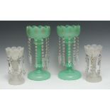 A pair of late 19th century green opaque glass lustres, picked out in gilt,