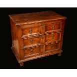 A William and Mary fruitwood block-front chest, moulded rectangular top above three long drawers,