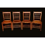 A harlequin set of seven Arts and Crafts period elm Cotswold dining chairs,
