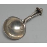 An Arts and Crafts silver caddy spoon, circular planished bowl,