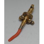 A George III silver-gilt baby's rattle, whistle terminal, six bells, coral teething haft, 12.