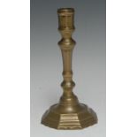 A late 17th century French brass octagonal candlestick, knopped stem, shaped base, 20cm high, c.