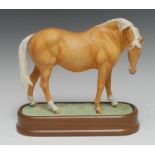 A Royal Worcester Palomino Thoroughbred Mare, model by Doris Lindner, 20cm high, plinth base,