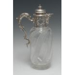 A Victorian silver mounted clear glass claret jug, hobnail-cut in wrythen bands,