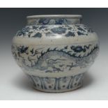 A Chinese temple jar, painted in underglaze blue with ferocious dragons,