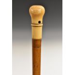 An early 18th century gentleman's ivory and malacca walking stick,