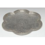 A Persian silver coloured metal lobed circular tray,