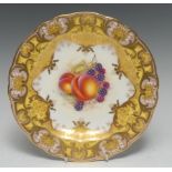 A Royal Worcester shaped circular cabinet plate, painted by John Freeman, signed,