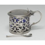 An early Victorian silver drum mustard, hinged cover, scroll handle,