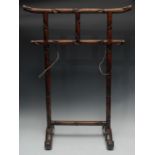 A Chinese hardwood rail, carved throughout with leafy bamboo shoots,