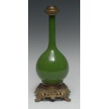 A Chinese monochrome ovoid bottle vase, glazed in tones of green, European mounted in gilt metal,