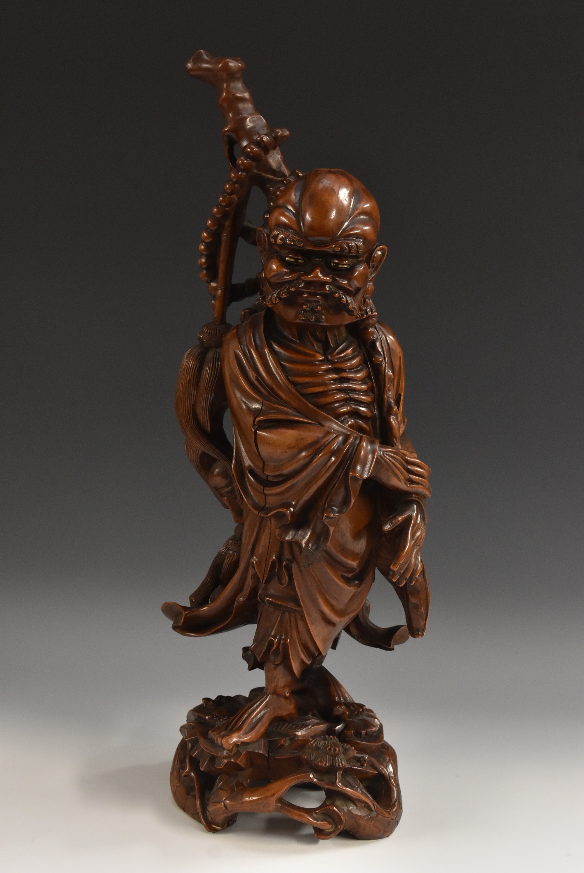A large Chinese hardwood carving, of an emaciated Buddhist,