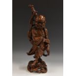 A large Chinese hardwood carving, of an emaciated Buddhist,