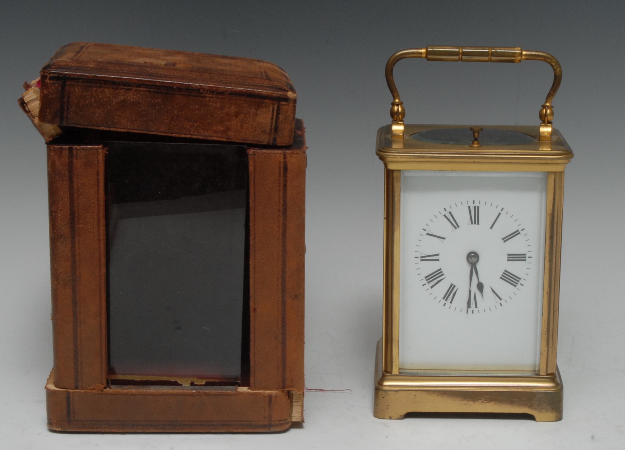 A 19th century brass repeating carriage clock, with Roman numerals, swing handle, bracket feet,