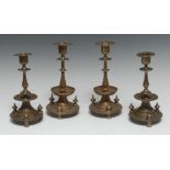 A pair of Continental brass candlesticks, possibly Spanish, urnular sconces with broad rims,