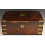 A 19th century rosewood brass mounted writing box, the interior with tooled leather writing surface,