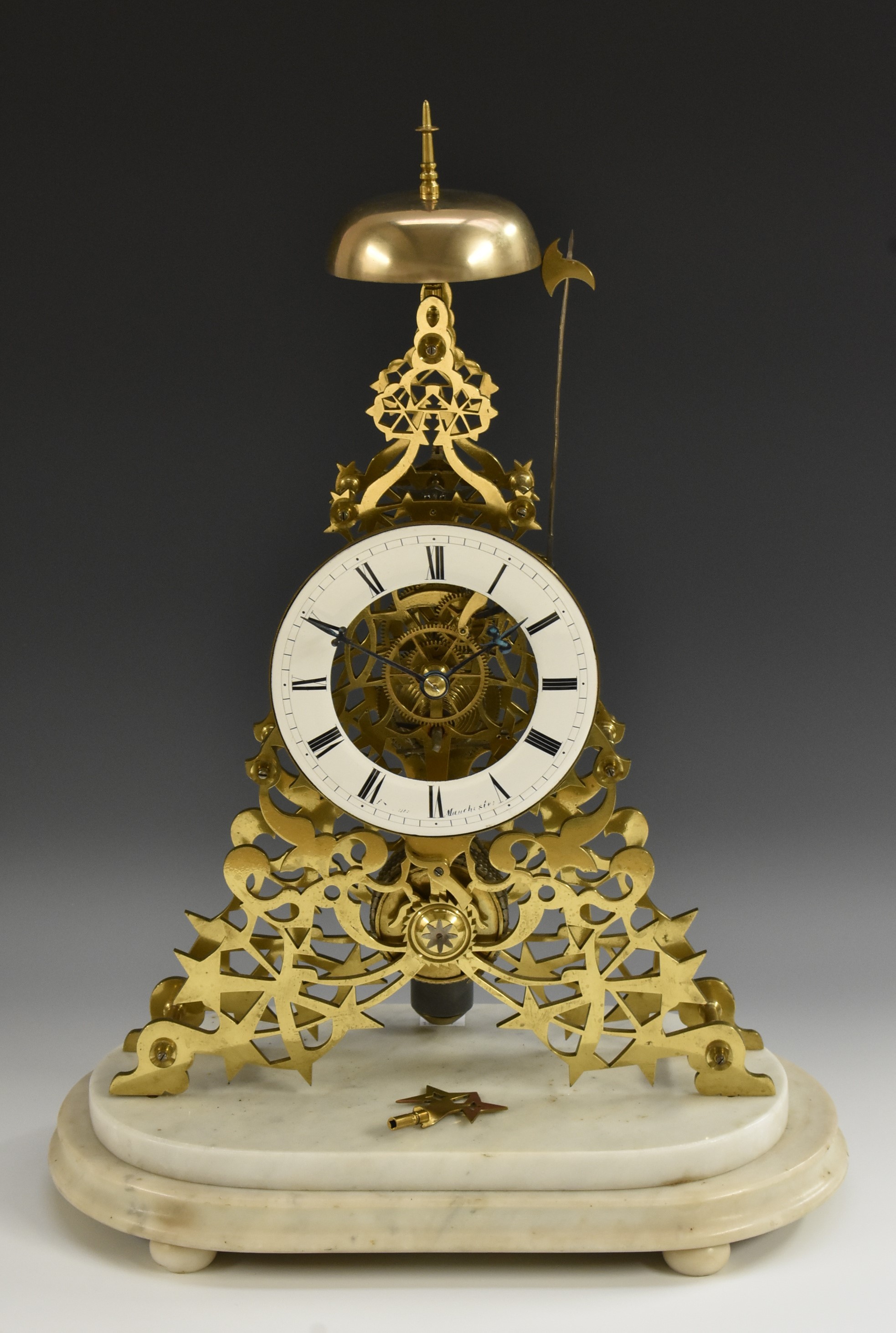 A mid 19th century brass skeleton clock, enamelled chapter ring, Roman numerals, signed White,